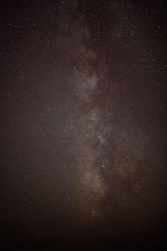 A vertical background of a milky way in a night starry sky