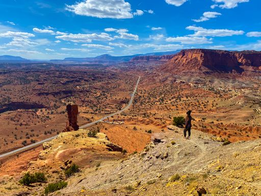 A hiker admiring the mesmerizing view of the Bryce Canyon National Park in the USA