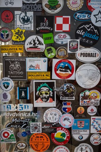 A vertical shot of travelers stickers on-mountain lodge in Tucepi, Croatia