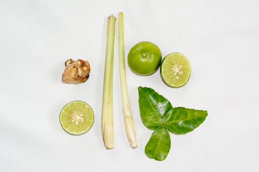 A top view of spicy lemongrass soup or tom yam is THAI food isolated on a white background