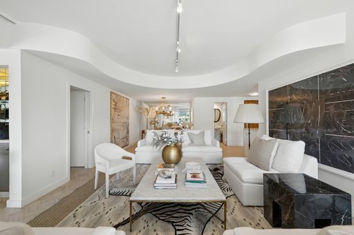 Stylish, light-filled condo with panoramic city views, sleek designer interiors, custom kitchen, luxe bathrooms, and elegant living space.