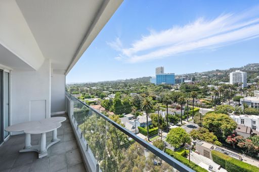 Stylish, light-filled condo with panoramic city views, sleek designer interiors, custom kitchen, luxe bathrooms, and elegant living space.