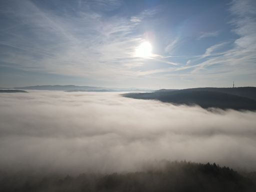 A beautiful shot of a town under the foggy and cloudy skies