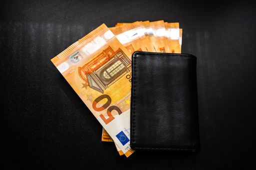 A man wallet with money on the table, wallet with EURO