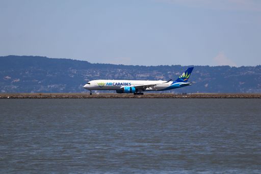 Air Caraibes Airbus A350-900 arriving at San Francisco International Airport with the Diablo Mountain Range in the background