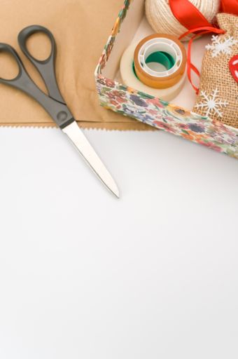 paperboard flower decorated box on white background with text space and stationery