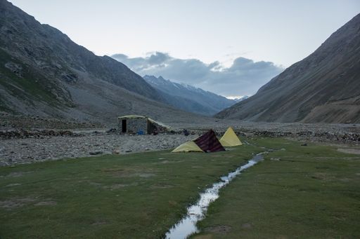 Darcha, Himachal Pradesh, India - July 2012: Tents pitched on a beautiful campsite on a meadow on a trekking route in the Himalayan valley of Zanskar