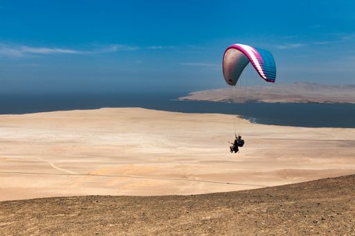 Paragliding at Paracas Desert in Ica, Peru.