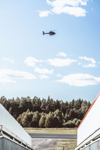 A Beautiful view from a plane ladder, forest trees under a helicopter flying in the blue sunny sky