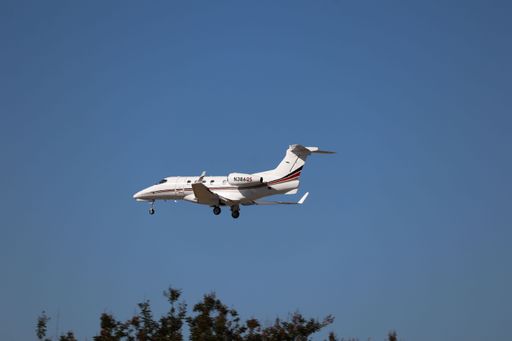 NetJets Embraer Phenom 300 landing at San Jose airport from Santa Monica