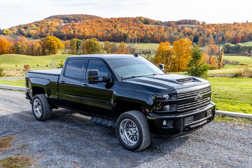 A black Chevrolet Silverado pickup truck