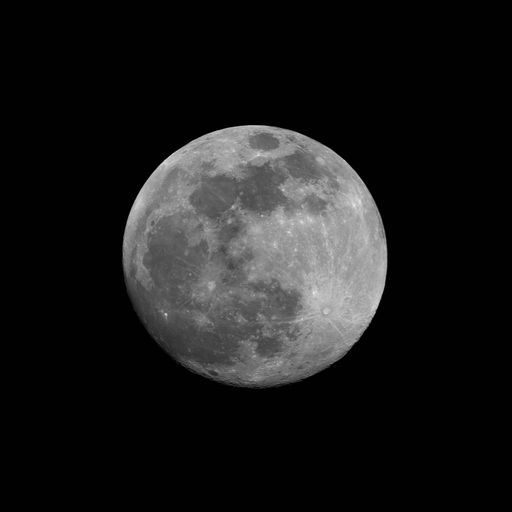 The grey full moon isolated in the dark night sky