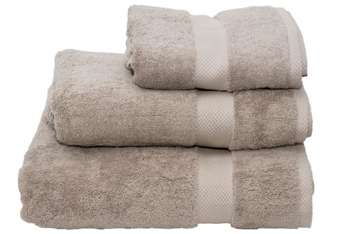 A closeup of folded gray towels isolated on a white background