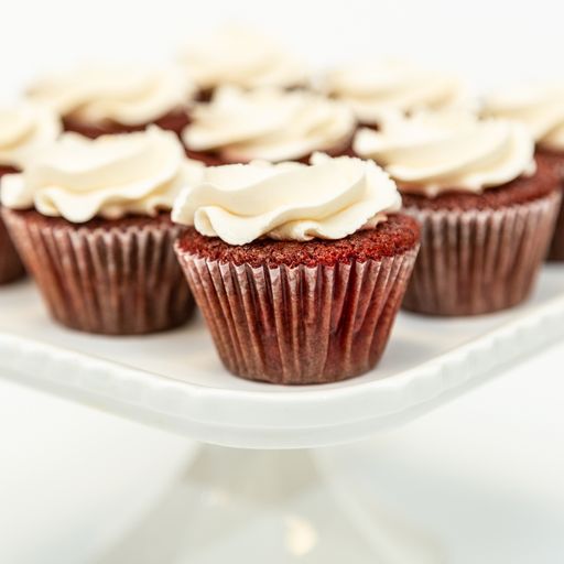 A selective focus shot of professionally baked red velvet cupcakes