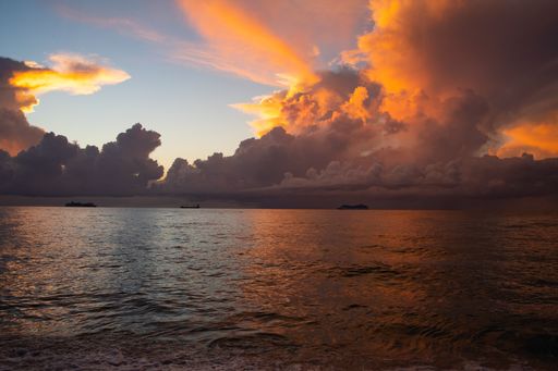 A landscape of the Atlantic Ocean under a cloudy sky during a breathtaking sunrise in the morning