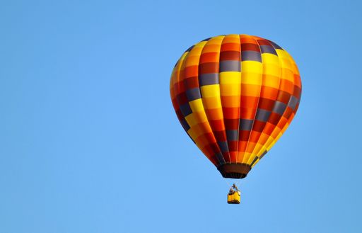 A beautiful view of colorful hot air balloon against blue sky