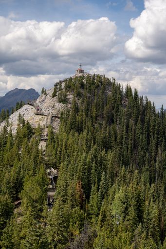 An aerial shot of the cosmic ray station of the sulphur mountain in Canada under cloudy s