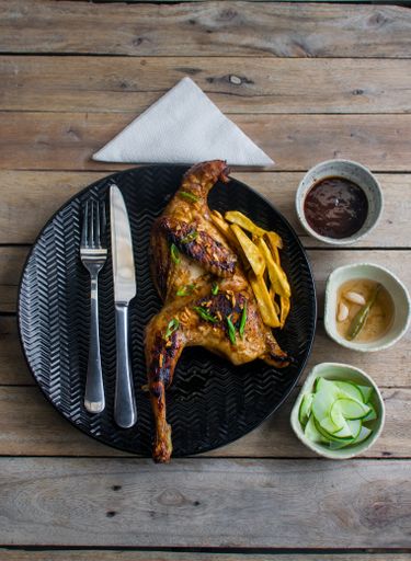 A vertical top view of chicken with sauces