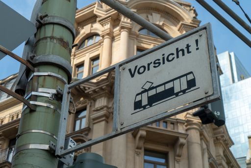 A close-up shot of a sign warning about trolleybuses