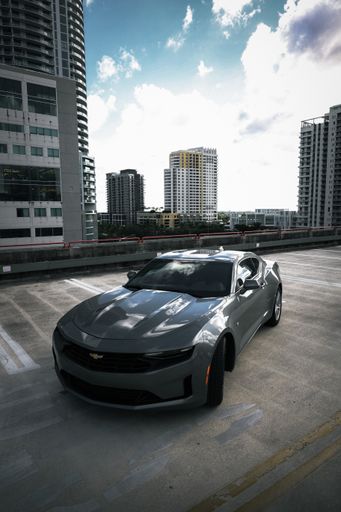A vertical shot of a Chevrolet Camaro car in a street
