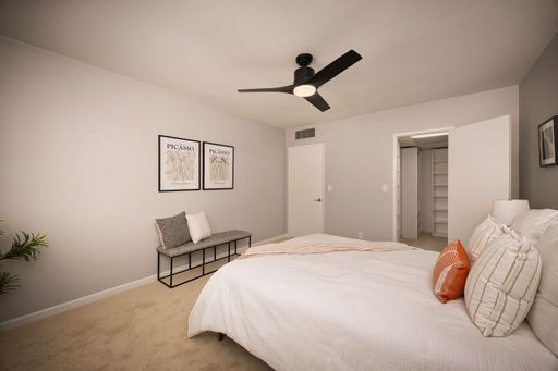 Modern condo featuring an upgraded kitchen, elegant interiors, private balcony with courtyard views, and access to pool and resort-style amenities.