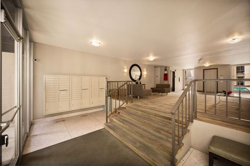 Modern condo featuring an upgraded kitchen, elegant interiors, private balcony with courtyard views, and access to pool and resort-style amenities.
