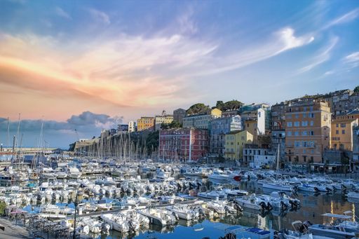 Corsica, Bastia, typical houses in the harbor in summer, sunset