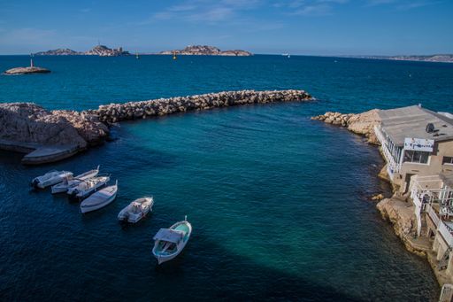 The boats anchored in a small harbor on the coast of Vallon des Auffes. Marseille, France