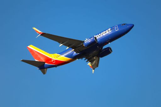 The Southwest Airlines Boeing 737-700 takes off from San Jose Airport heading to Burbank.