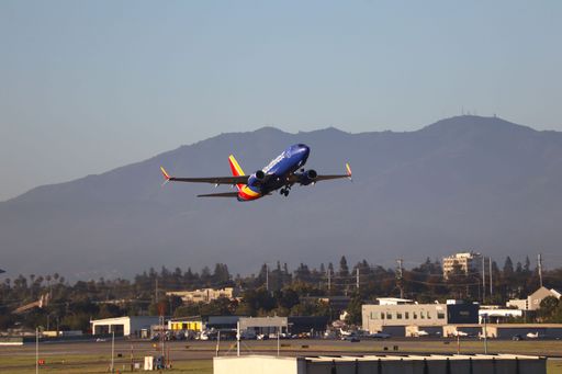 The Southwest Airlines Boeing 737-700 takes off from San Jose Airport heading to Burbank.