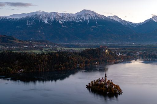 Slovenia, Lake Bled, a high angle shot of Bled Island with the church and beautiful scenic view of Julian Alps in the background