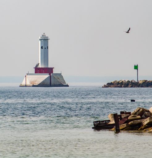 A view of a big lighthouse in the sea