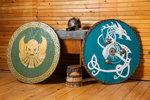 The three wooden medieval shields in a room