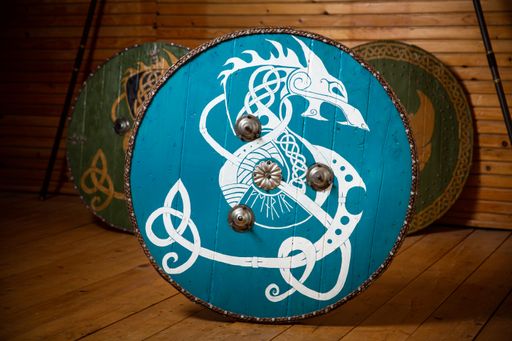 A closeup of a dragon design handmade decorative shield