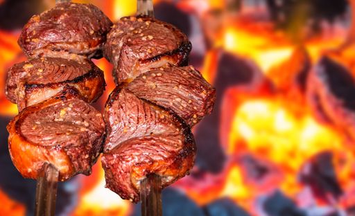 A selective focus shot of rump steak, Brazilian barbecue on fire