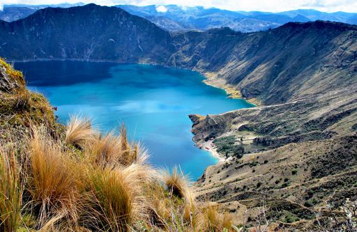 View of a water-filled crater lake and the most western volcano in the Ecuadorian Andes