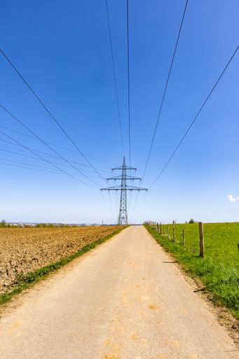 The transmission tower with a clear blue sky