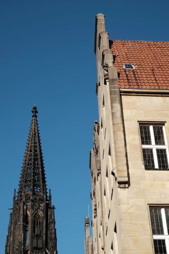A vertical shot of St Lambert's Church under the sunlight and a blue sky in Munster, Germany