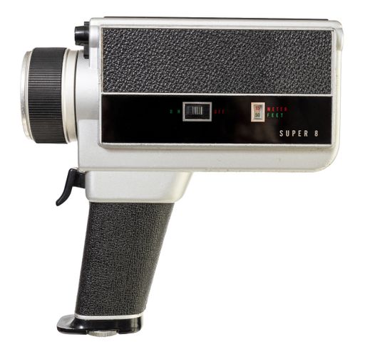 Vintage super 8 film camera isolated on white background. Side view