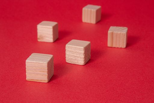 A closeup of the wooden blocks isolated on red background.