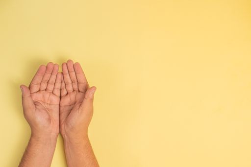Male hands holding nothing on a  background with a copy space
