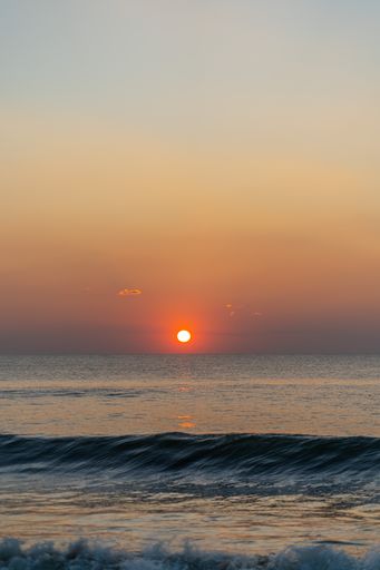 A vertical shot of a beautiful sea at sunset in Berlin, Germany