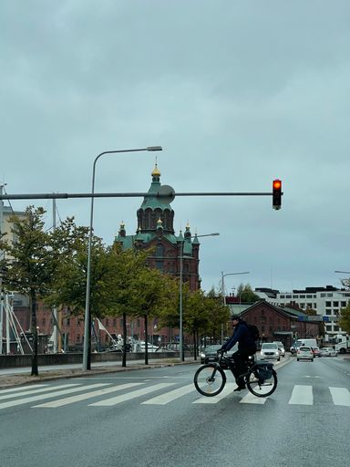 A tranquil view of a young man cycling in the streets of Helsinki, Finland