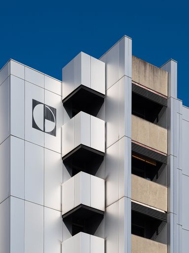 A building in the city of Novara, Piedmont, Italy against the blue sky