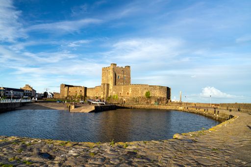 The Medieval Norman Castle against a cloudy sky in Carrickfergus, Northern Ireland