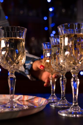 A closeup shot of champagne glasses filled with champagne in a restaurant