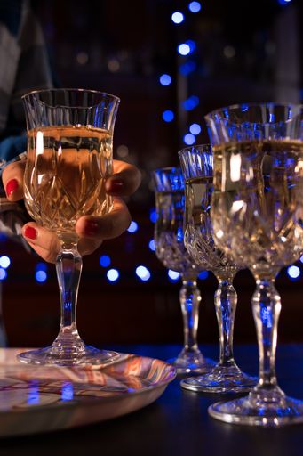 A closeup shot of champagne glasses filled with champagne in a restaurant