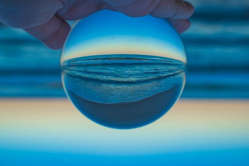 A beautiful creative shot of a beach with a crystal lens ball