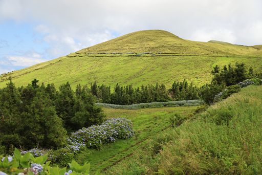 A beautiful landscape of green hills under the blue sky