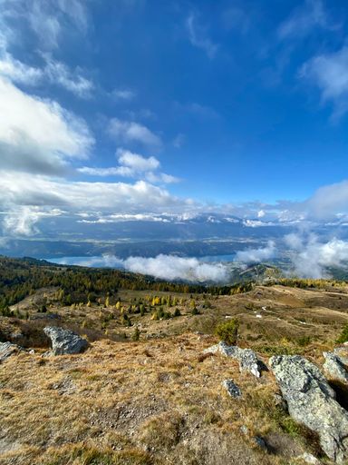 A beautiful mountain landscape against a cloudy blue sky